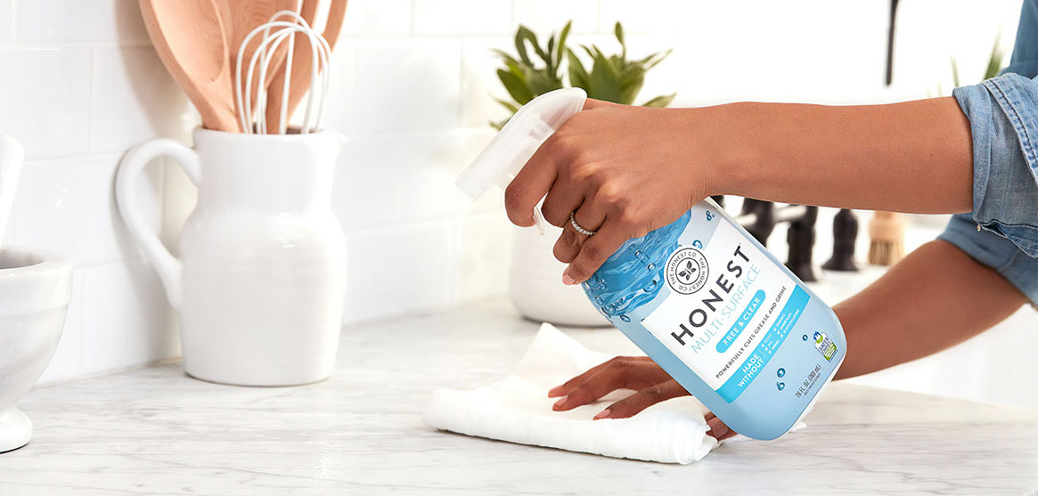 Person Cleaning Countertop